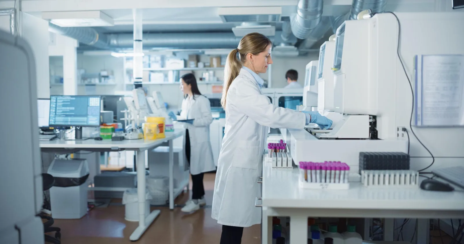 Pathology laboratory technician conducting quality assurance review